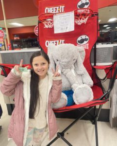 A student with Veda the stuffed elephant at Hannaford in East Greenbush