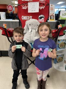 Students with Veda the stuffed elephant at Hannaford