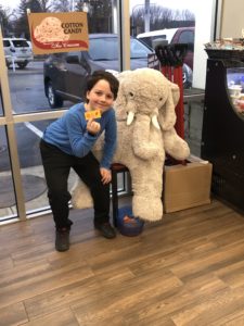 A student with Veda the stuffed elephant at the Stewart's in East Greenbush
