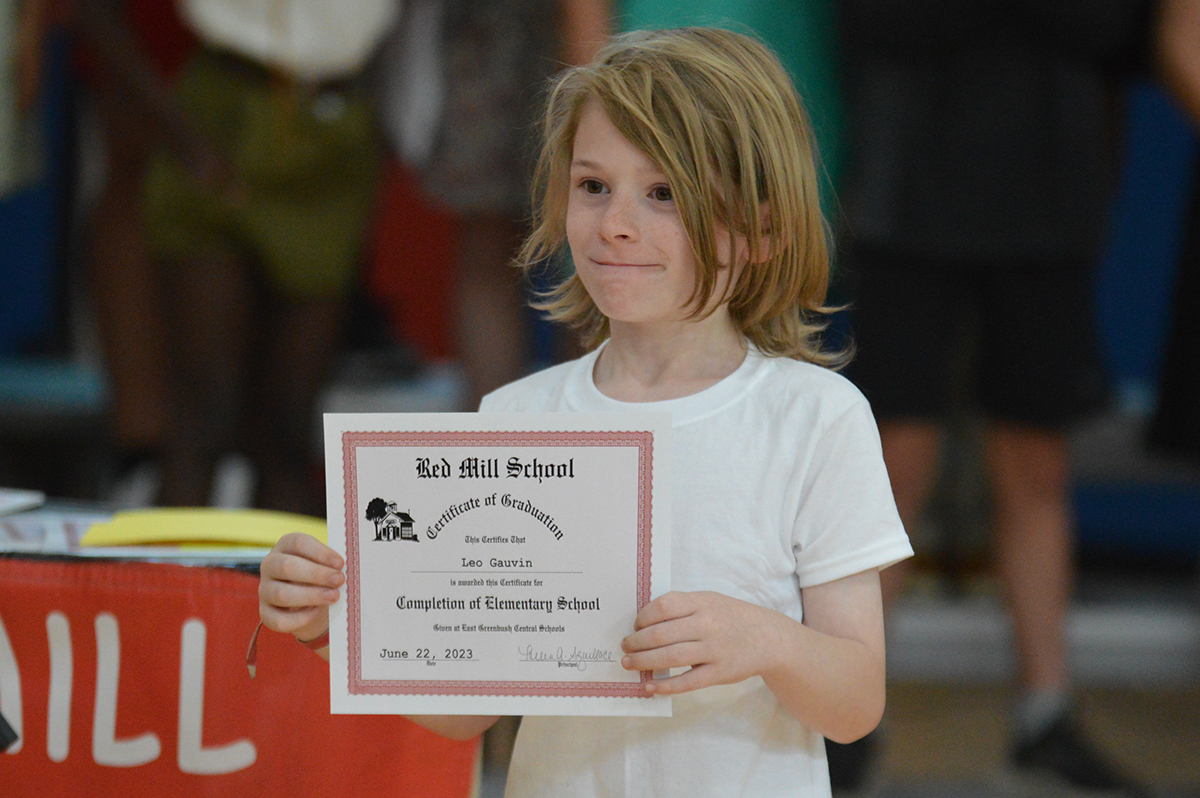 Student holding certificate at the 2023 Red Mill Moving Up Ceremony