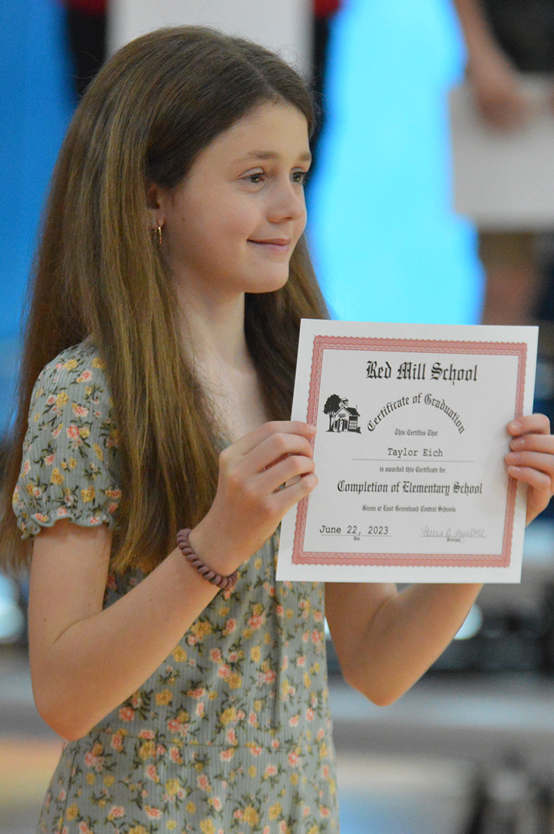 Student holding certificate at the 2023 Red Mill Moving Up Ceremony