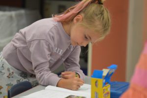 Kindergarten students practiced their writing skills during the Elevate Summer School program.