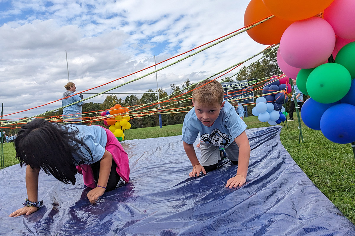 Students run through an obstacle course during the Jaguar Jog.