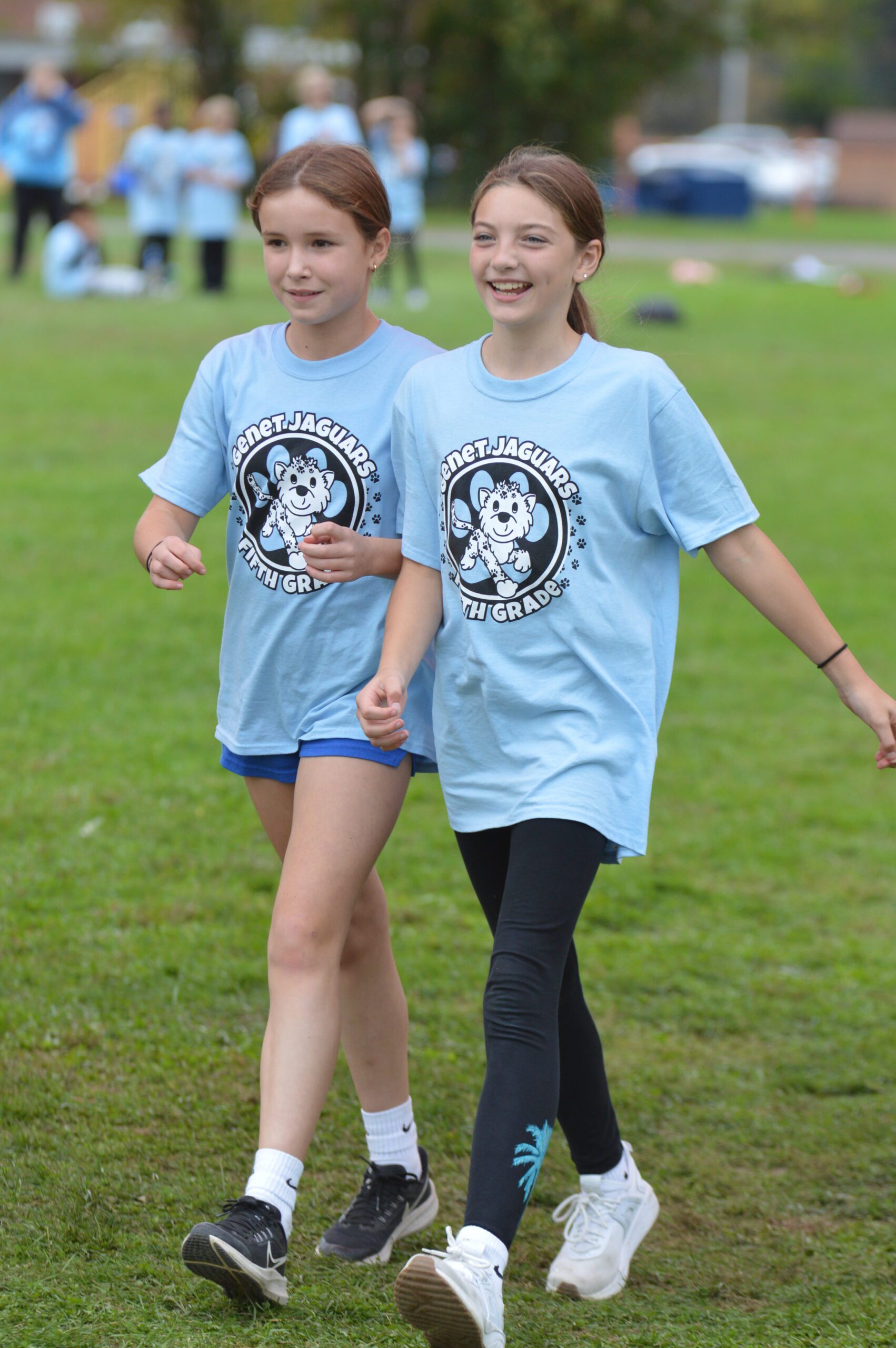 Students walk with each other during the Jaguar Jog.