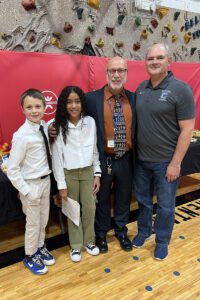 Bell Top fifth grade students Kyle Rodgers and Jazmarie Garcia with Principal Martin Mahar and Board of Education President Michael Buono.