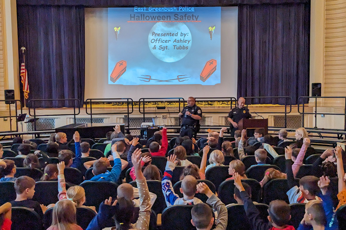 Officer Ashley and Sgt. Tubbs from the East Greenbush Police Department lead a Halloween safety presentation at Genet Elementary School.