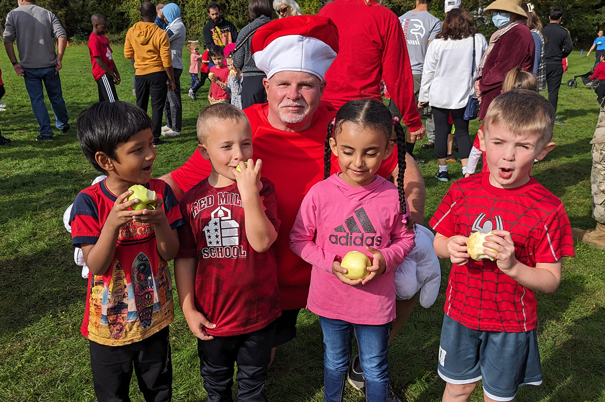 Students with Mr. Welge at the Red Mill Great Apple Race