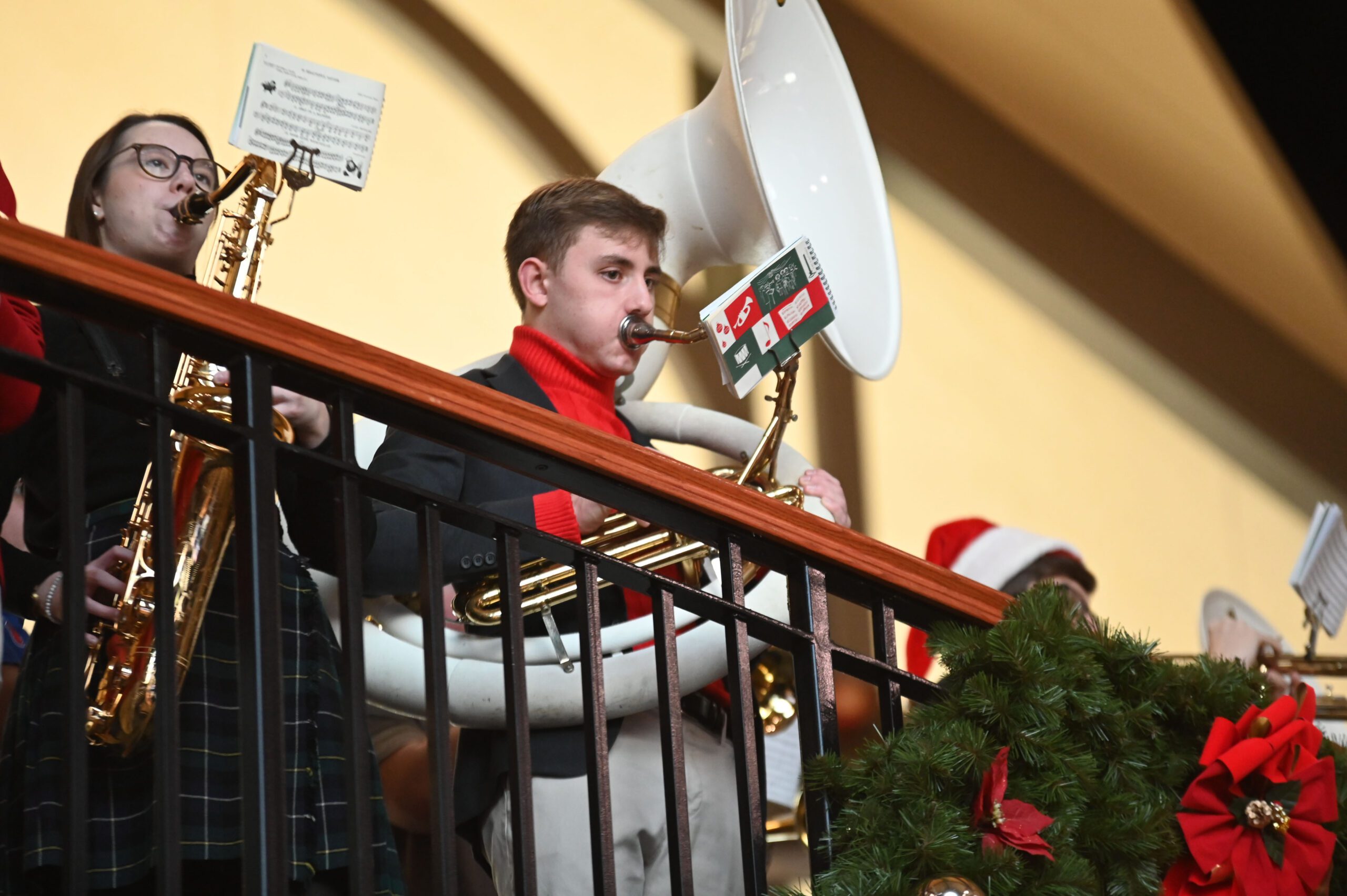Columbia High School students perform holiday music for travelers at the Joseph L. Bruno Rail Station in Rensselaer on Friday morning.