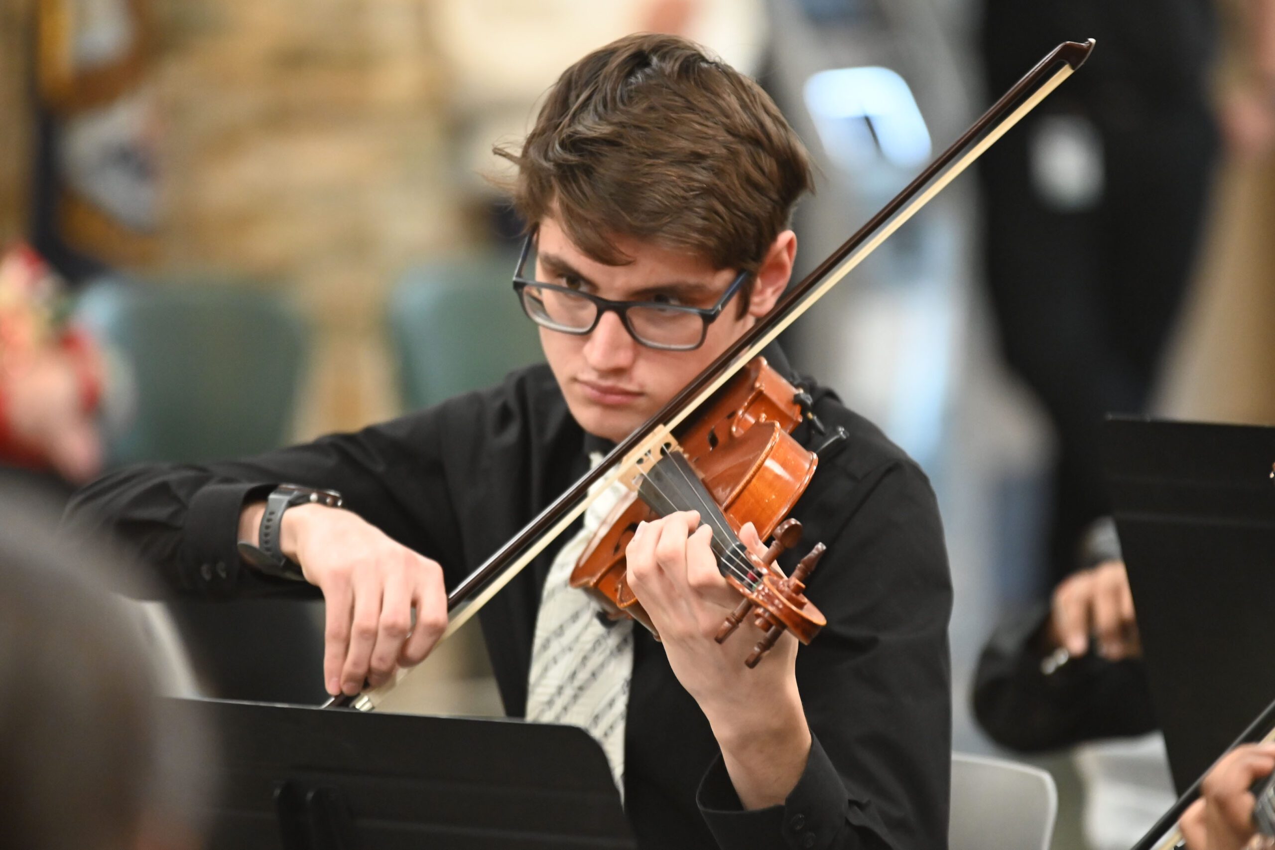 Student playing music at holiday concert
