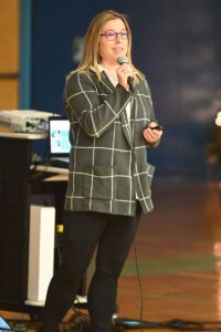 Questar STEM High School Principal Kim Sparkman speaking at a Goff Middle School assembly.