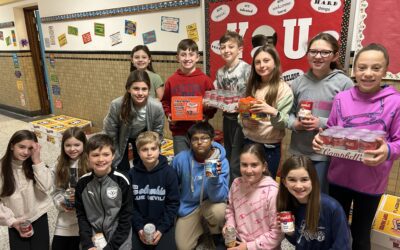 Genet Donates Nearly 1,500 Canned Goods to Food Pantries
