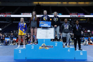 Bella Satalino stands on the podium at the NYS Wrestling Championships (courtesy Yanger Photography)