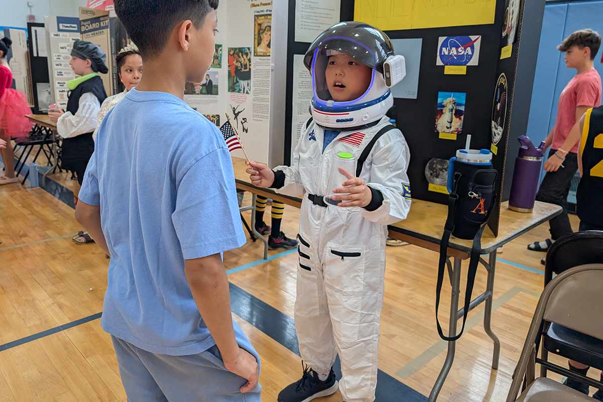 A student dressed as Neil Armstrong at the Genet Wax Museum