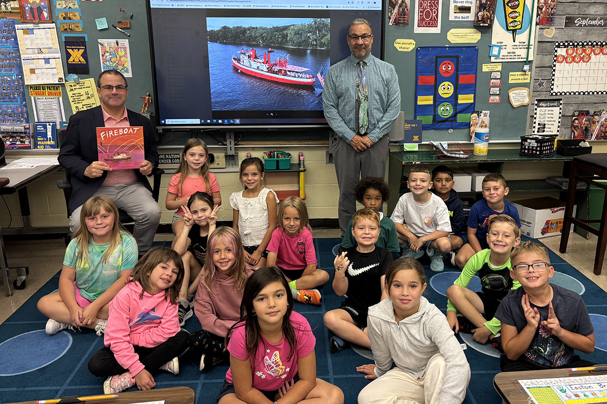 Principal Dan Garab reading the book Fireboat to John Flanagan's 2nd grade class at Green Meadow Elementary School.