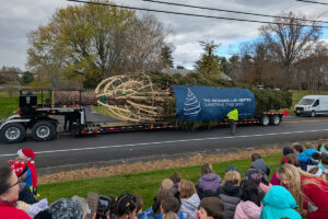 Rockefeller Center Christmas Tree on a flatbed truck in front of Genet Elementary School