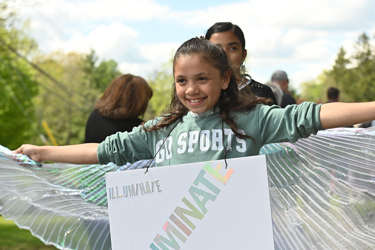 Student walking in Bell Top Book Club Vocabulary Parade