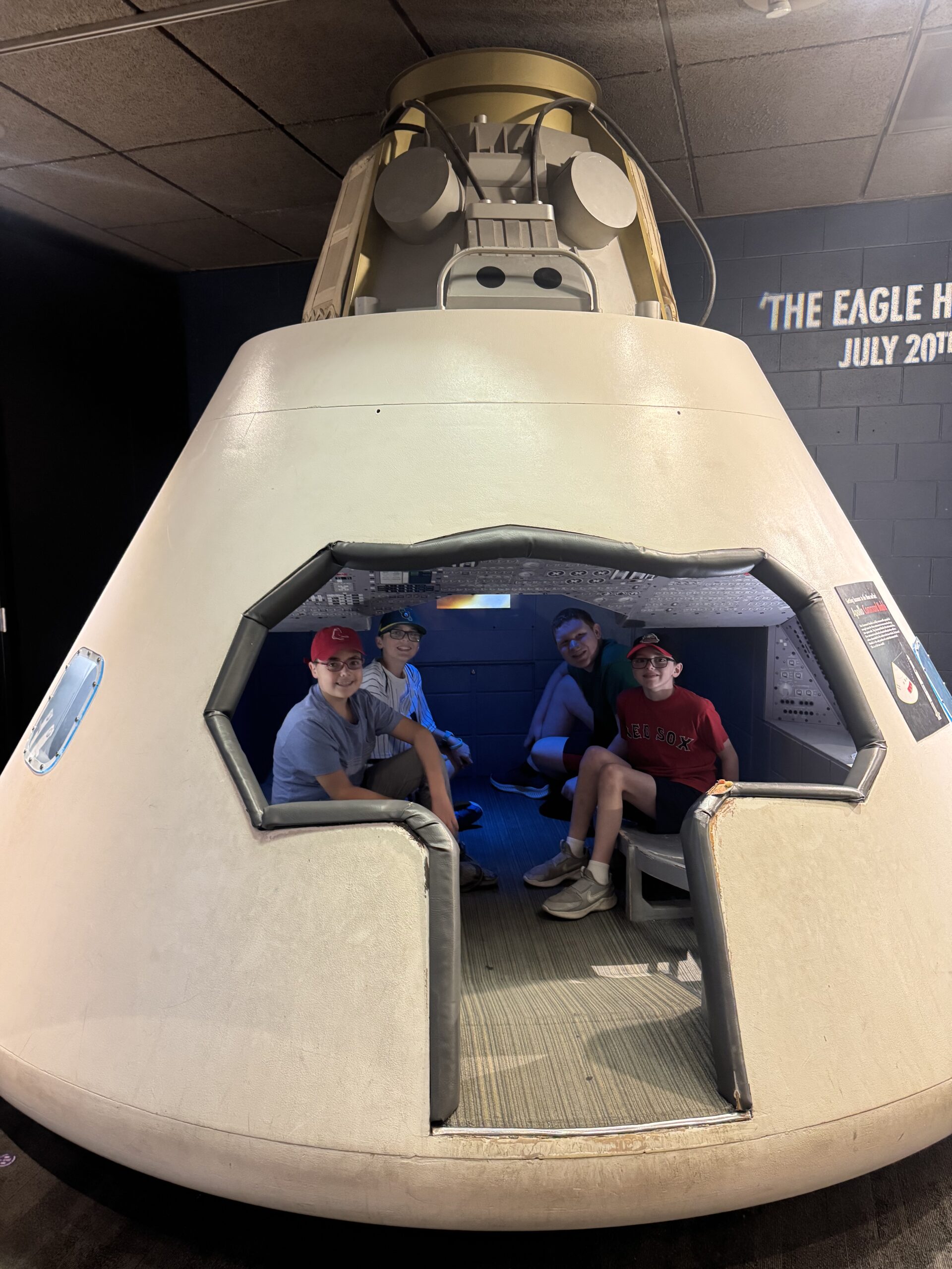 Students in space capsule at Boston science museum