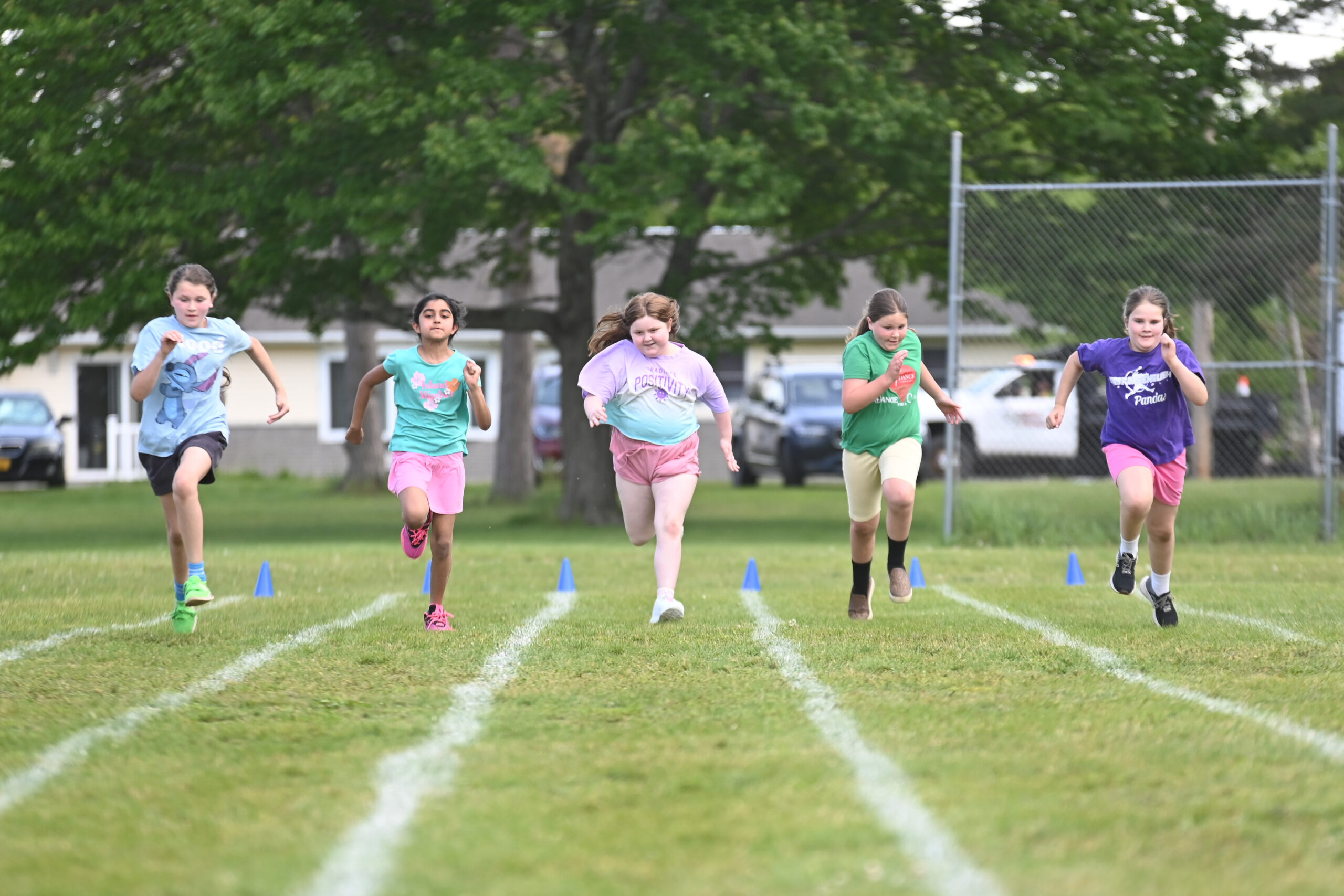Students running a race at Green Meadow Field Day