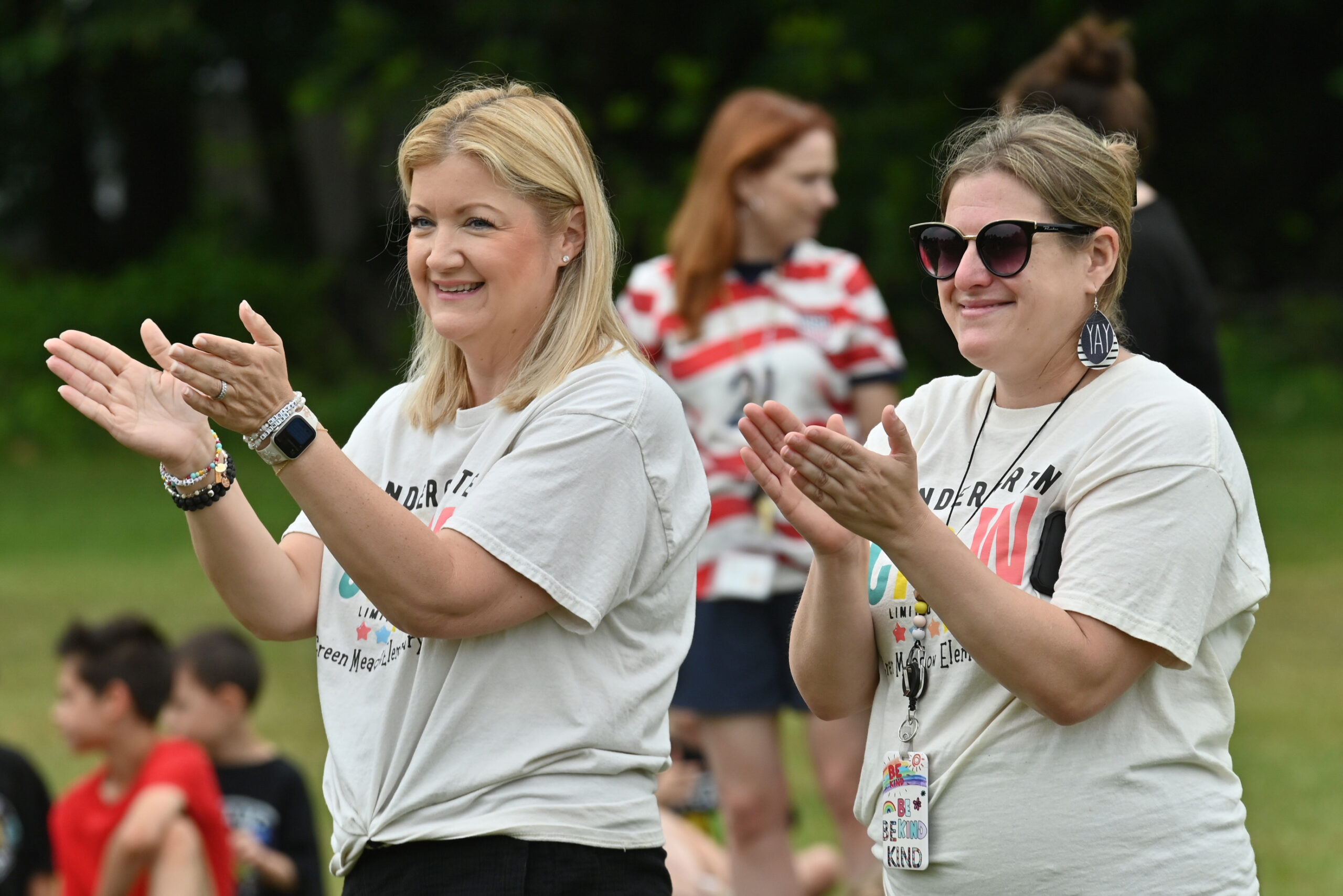 Green Meadow teachers cheer on kindergarten students competing at Field Day